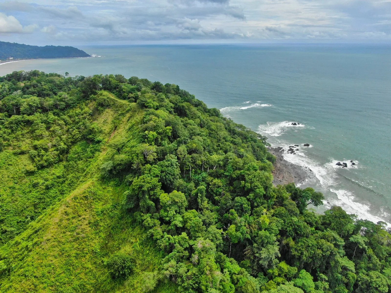 Jungle headland meets the Pacific · Jacó